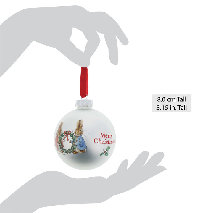 Peter Rabbit and Flopsy Holding Holly Wreath Bauble by Beatrix Potter