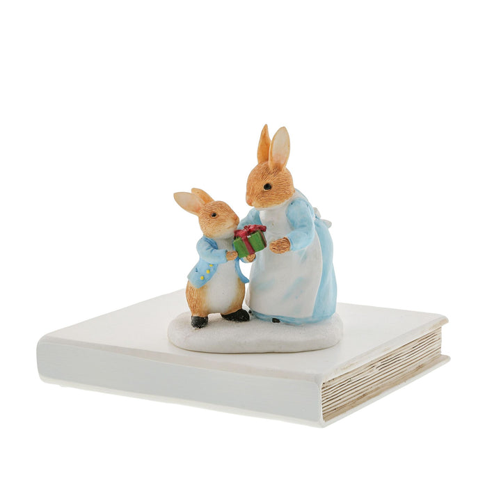 Mrs. Rabbit Passing Peter Rabbit a Present Figurine